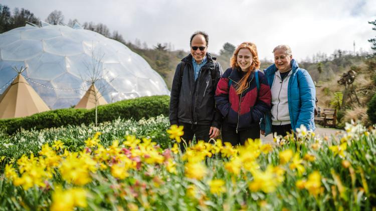 Family looking at spring flowers
