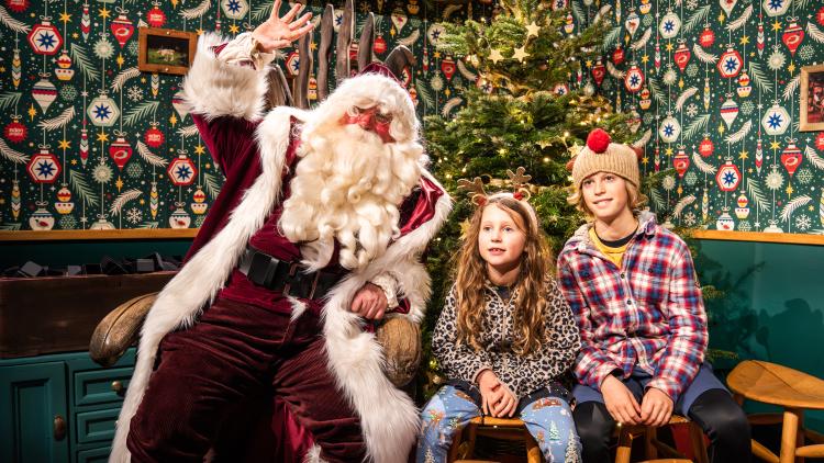 Father Christmas with children posing for a photo