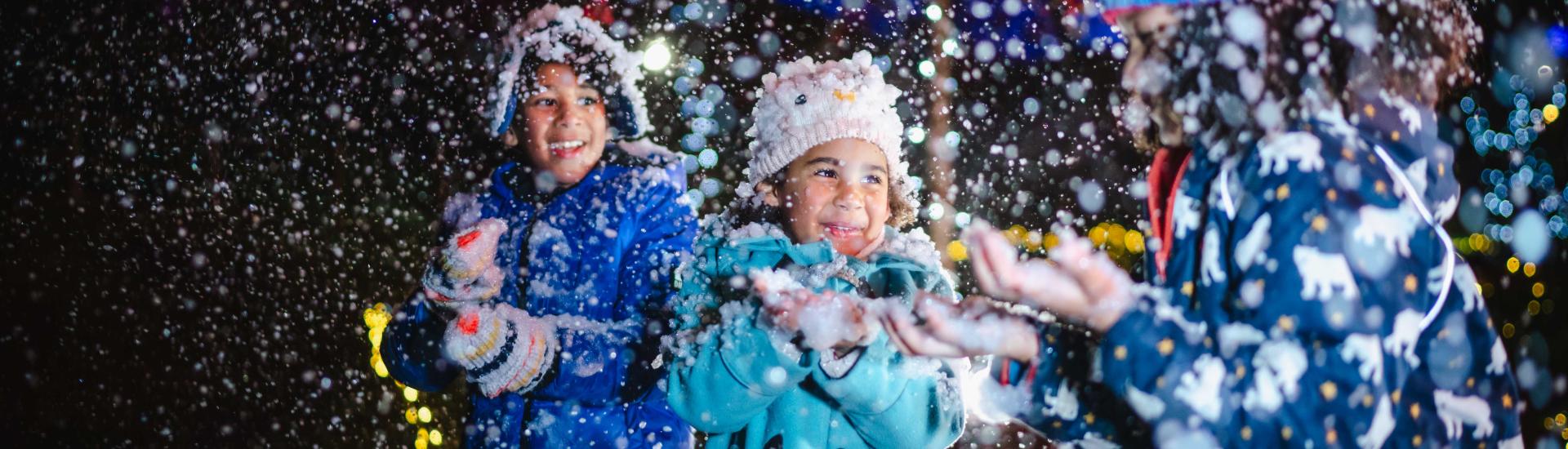 Children playing in artificial snow at the Eden Project