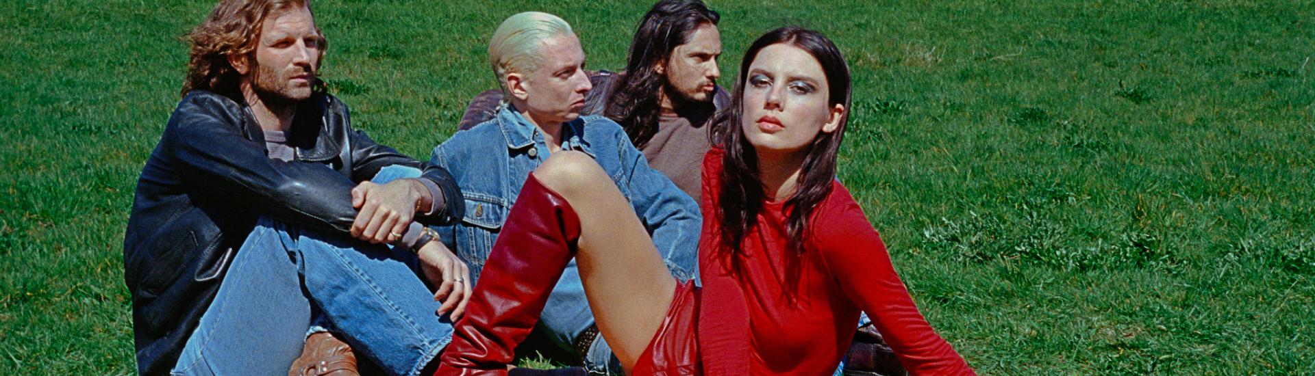 Music band Wolf Alice sat together as a group